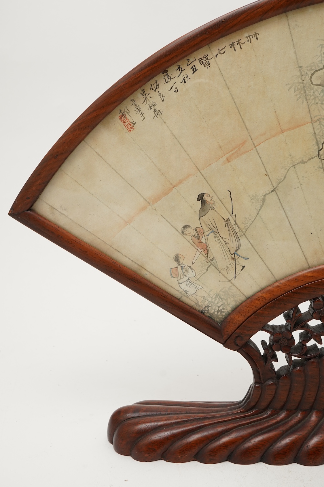 A Chinese painted paper fan leaf, 19th century, with hongmu frame and stand, early 20th century